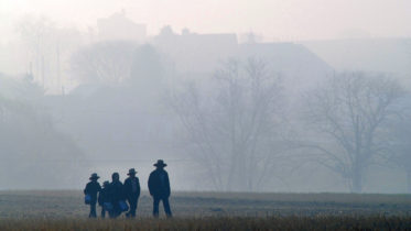 NICKEL MINES, PA - APRIL 2: Amish children head to school April 2, 2007 in Nickel Mines, Pennsylvania. The school opened six months from the day, October 2, 2006, that ten of their fellow students were shot, five of whom died, in their old schoolhouse that was a short distance away. (Photo by William Thomas Cain/Getty Images)