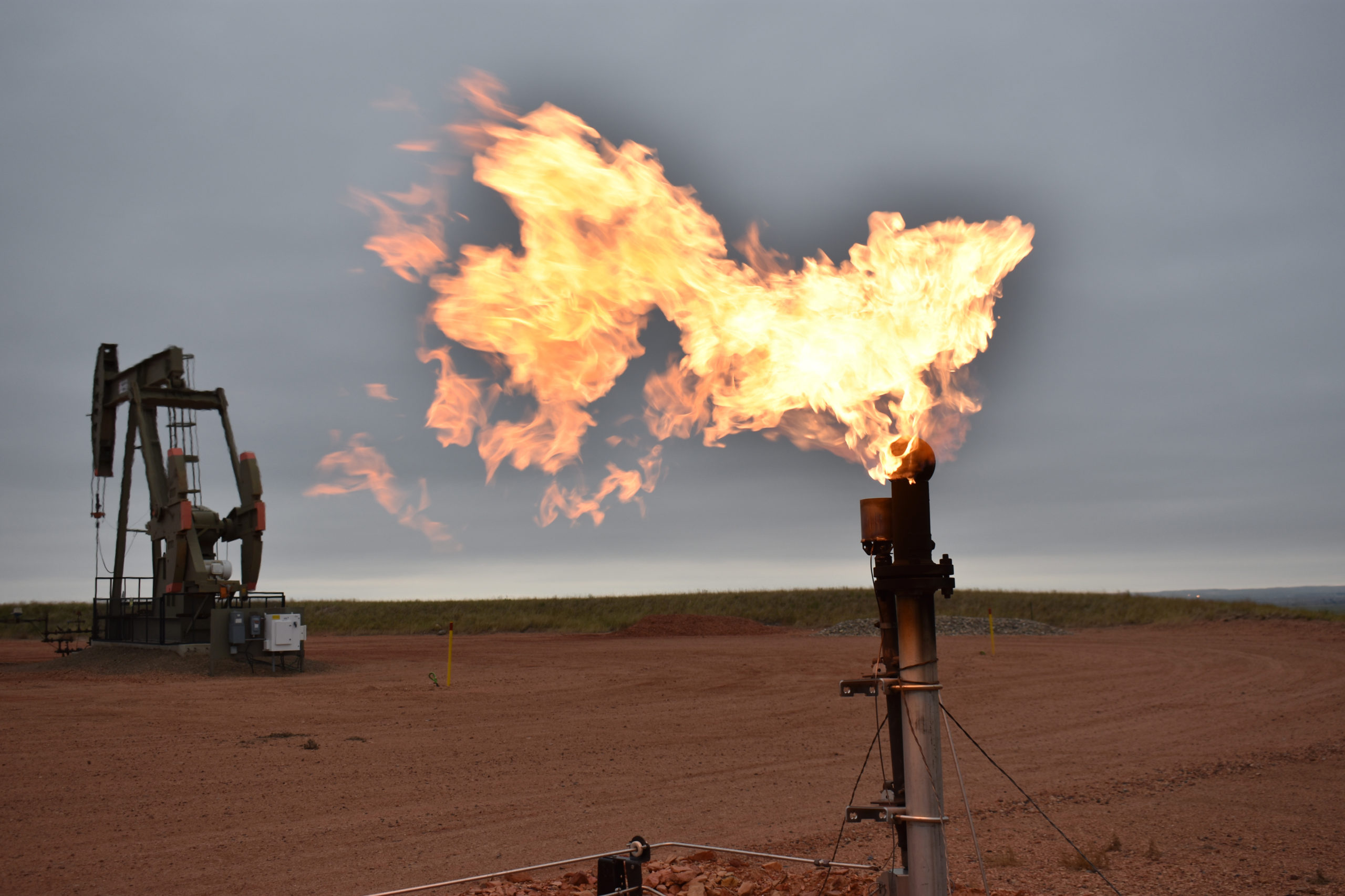A flare burns natural gas at an oil well