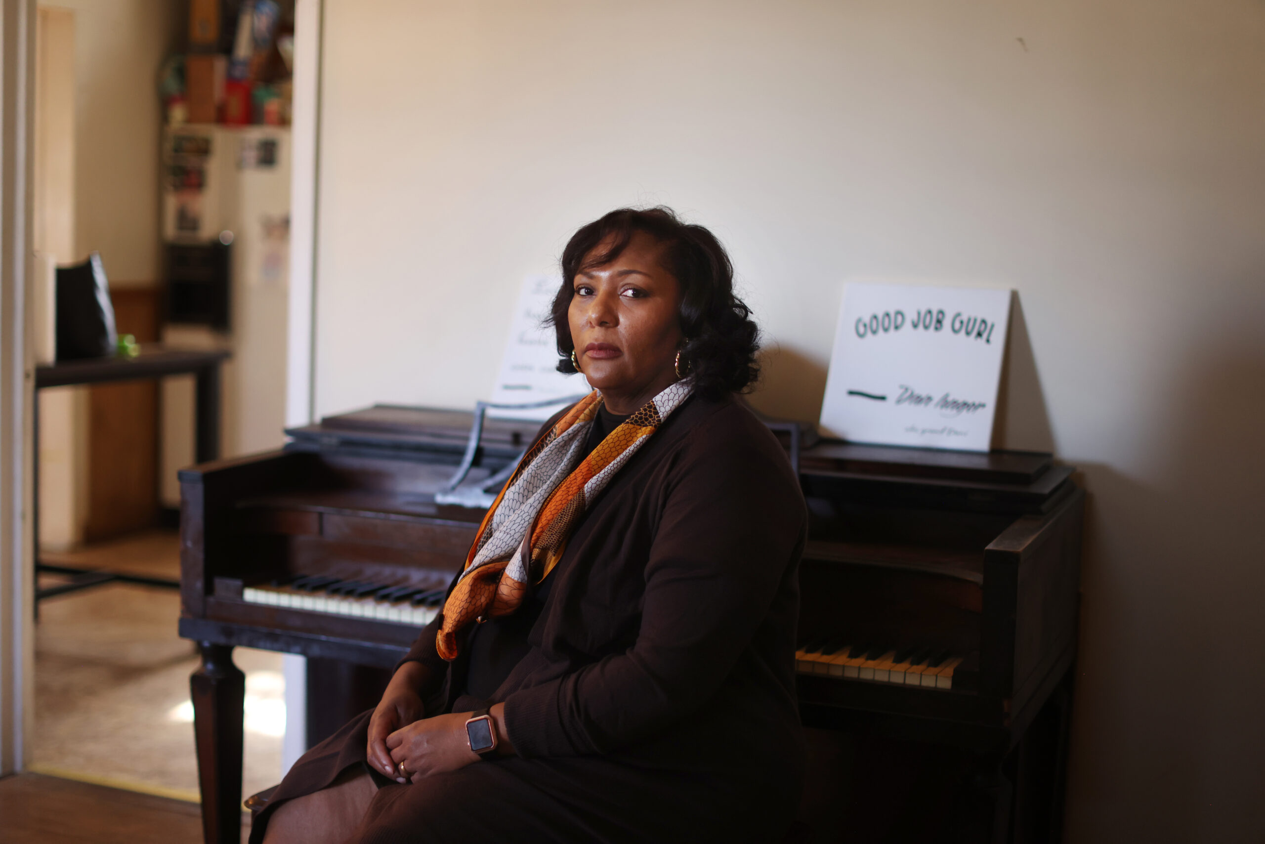 Tammy Crowder sitting in front of a piano